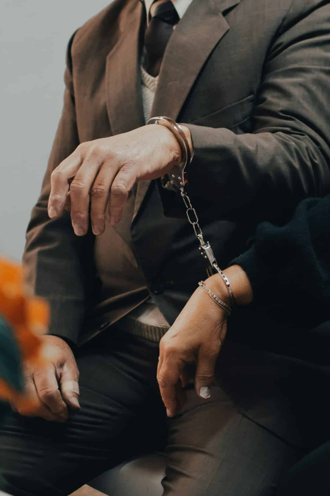 Photo by gaspar zaldo man in black suit jacket wearing silver chain bracelet